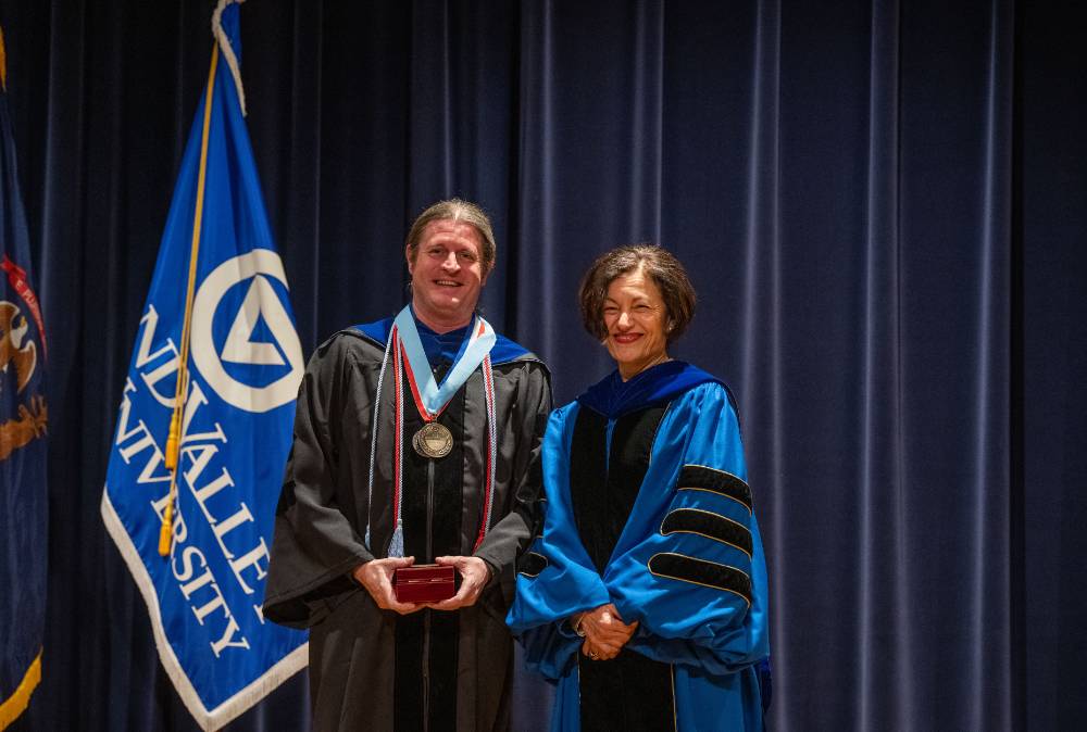 Provost poses for picture with man